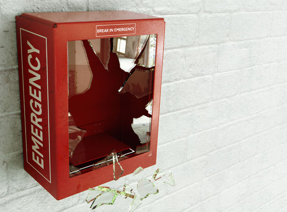 Empty red emergency box with broken glass Empty red emergency box with broken glass